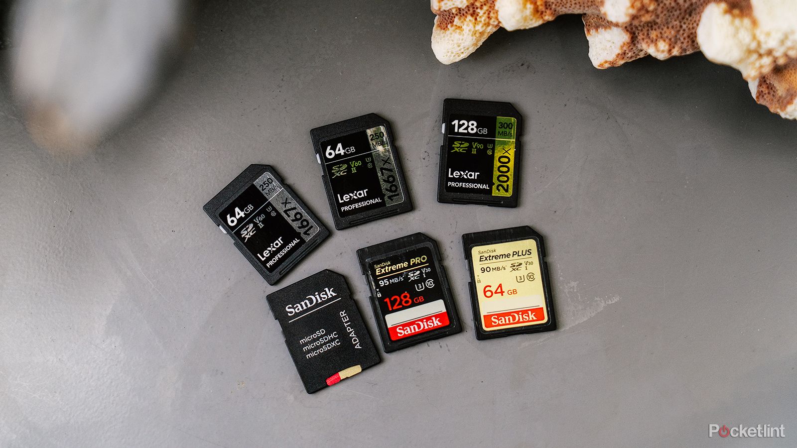 A collection of six SD cards on a table.