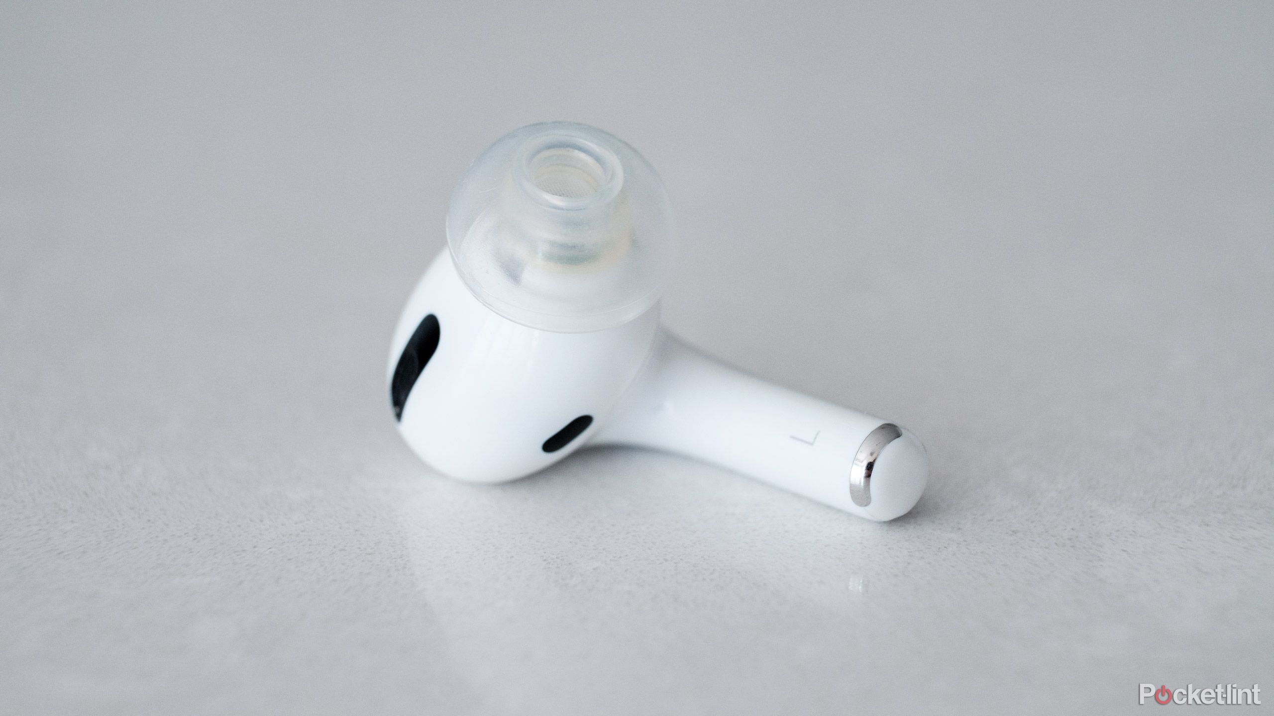 A single AirPods Pro ear bud with SpinFit ear tips