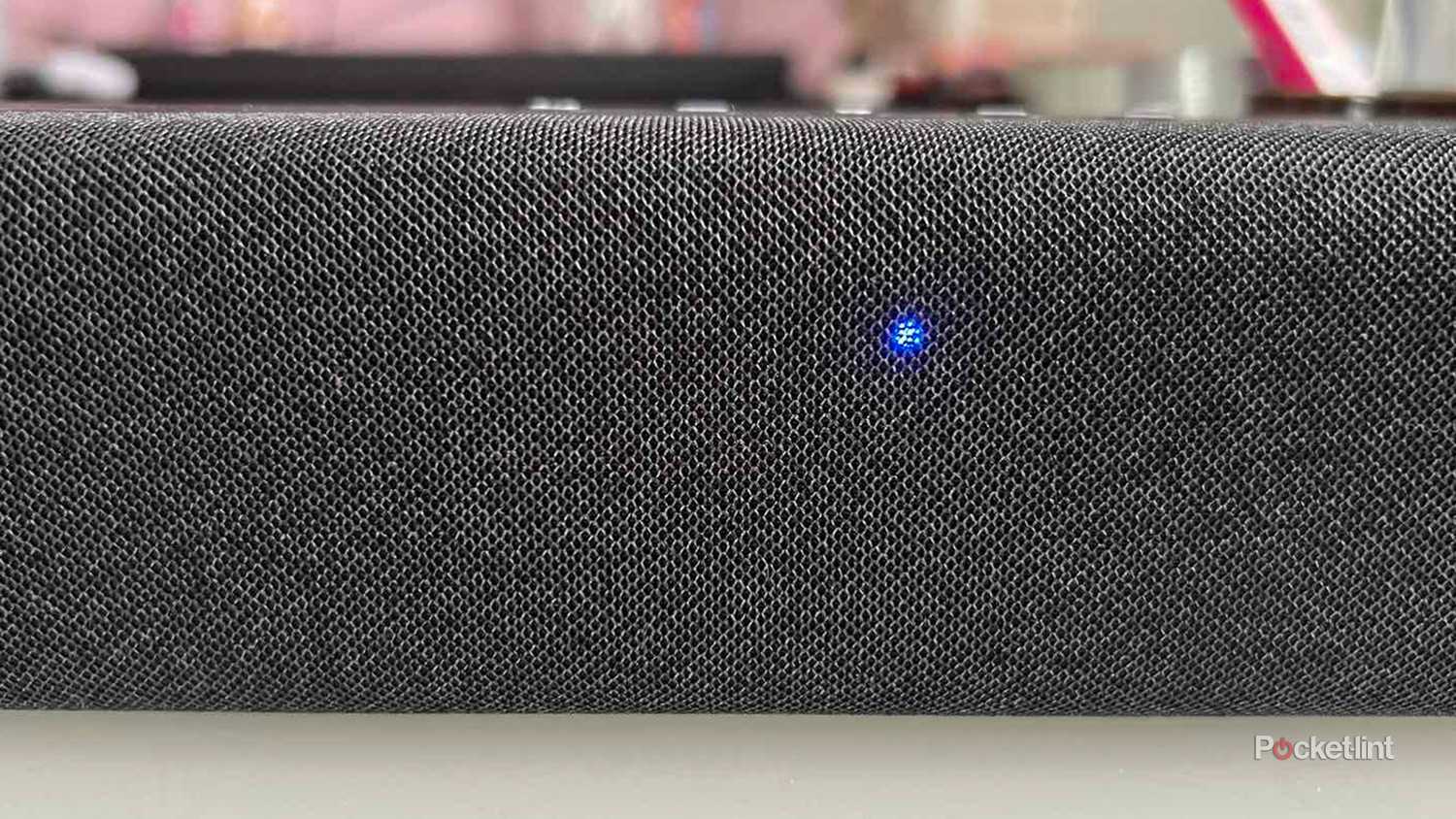 A blue light on an Amazon Fire TV Soundbar.