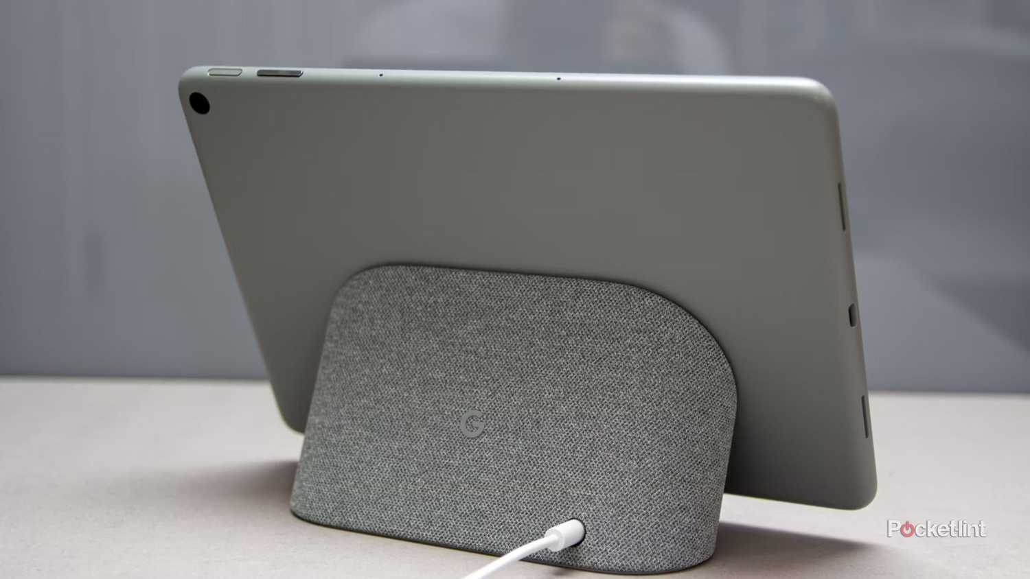 The back of a Pixel Tablet mounted to its charging dock.