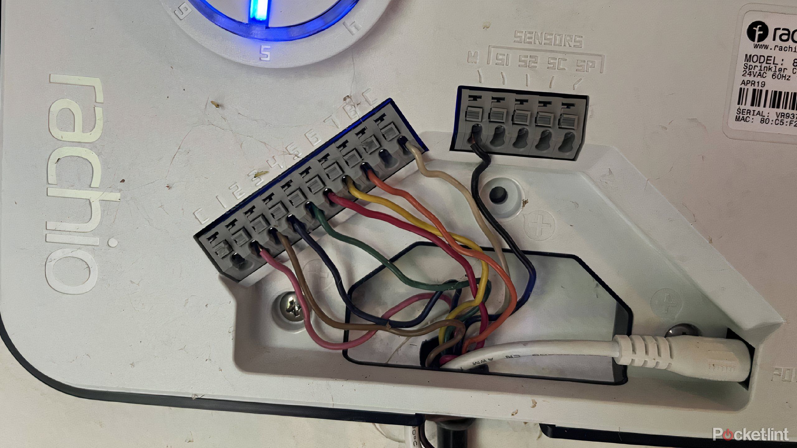 A Rachio Smart Sprinkler Controller with wiring.