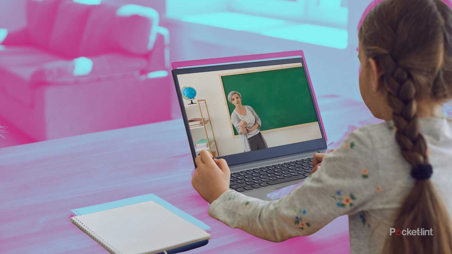 A girl taking a remote class on a laptop.