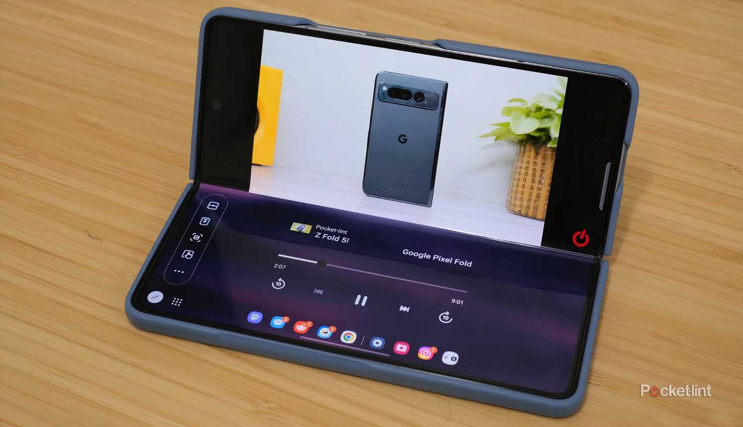 A Galaxy Z Fold 5 playing a YouTube video in Flex Mode.