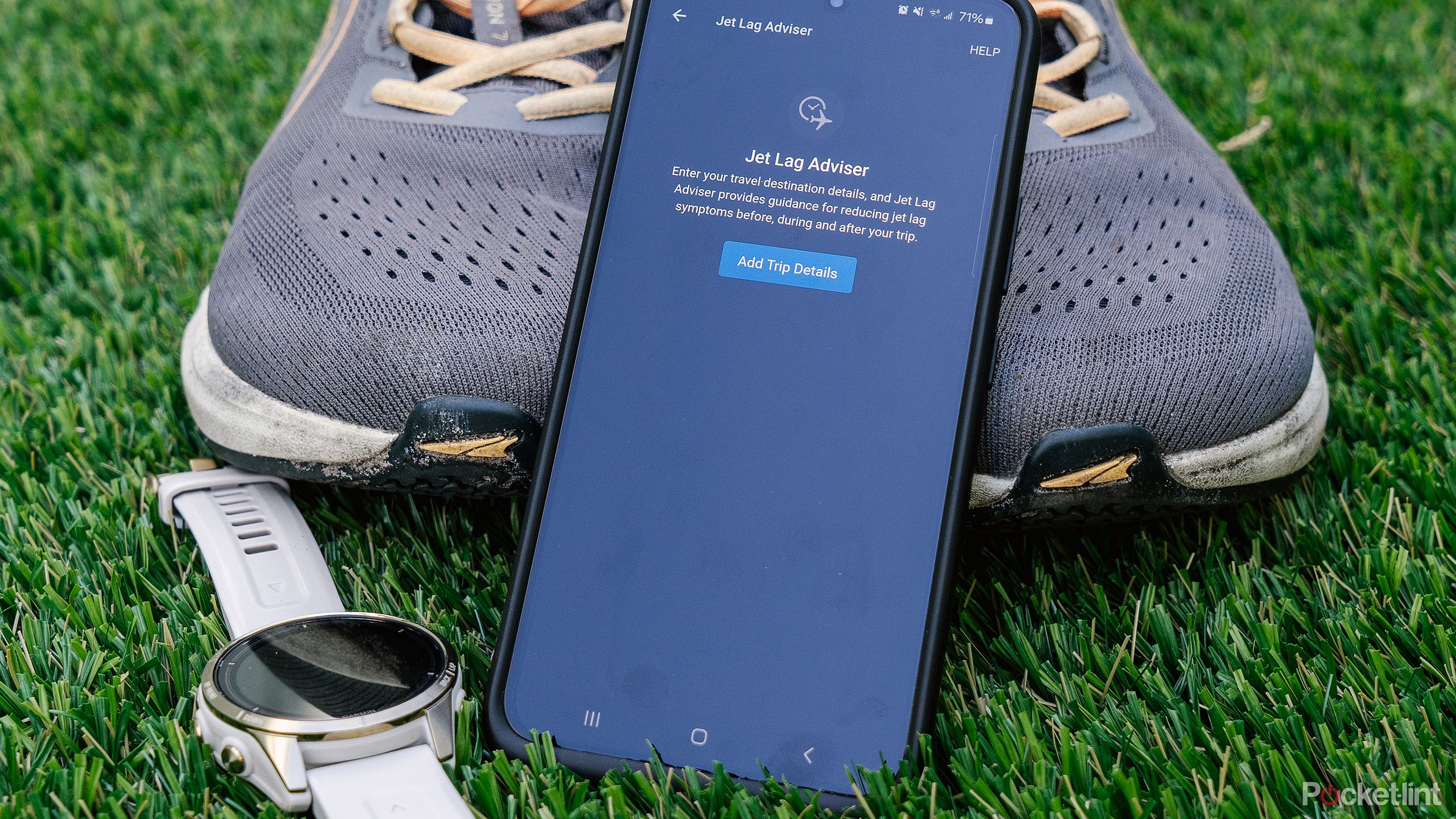 A phone with Garmin Jet Lag Advisor on the screen rests on some shoes.