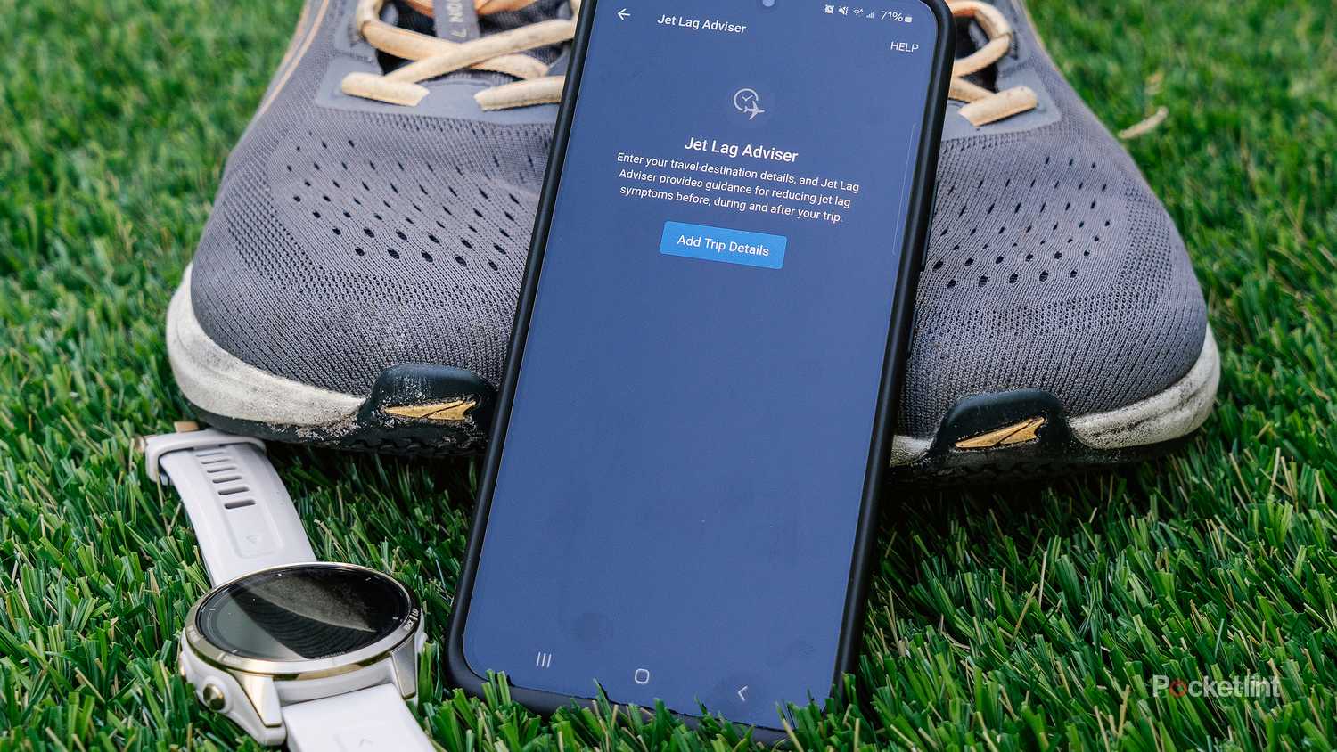 A phone with Garmin Jet Lag Advisor on the screen rests on some shoes.