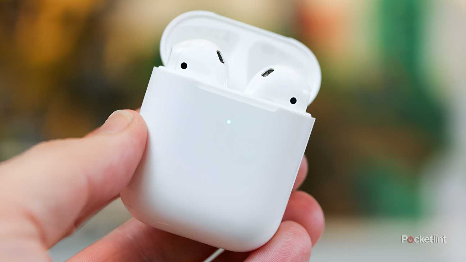 AirPods 2nd generation in a person's hands.