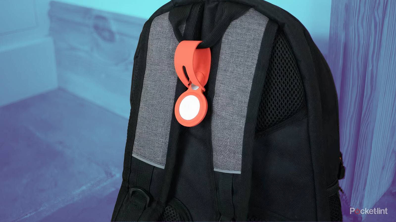An AirTag attached to a backpack.