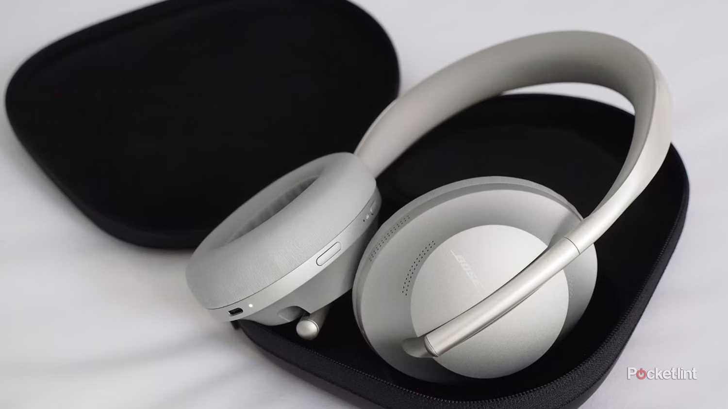 Bose Smart Noise Cancelling Headphones 700 in their case.
