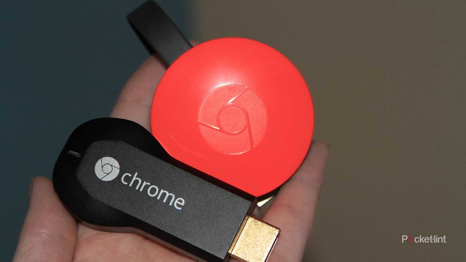 The first and second generation Chromecasts sitting next to each other.