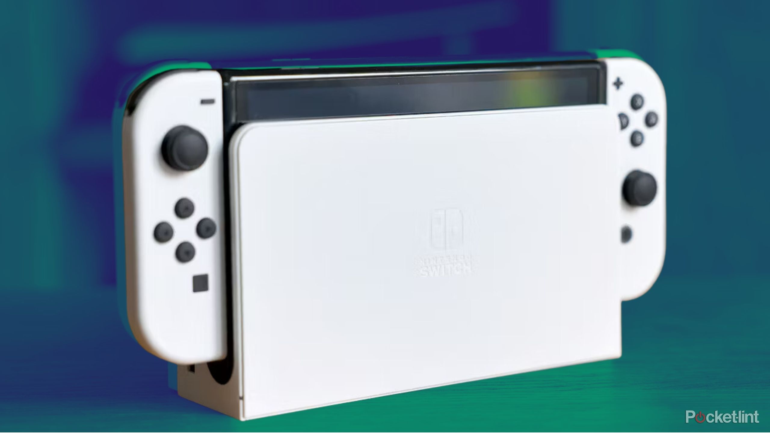 Nintendo Switch in dock on colored background