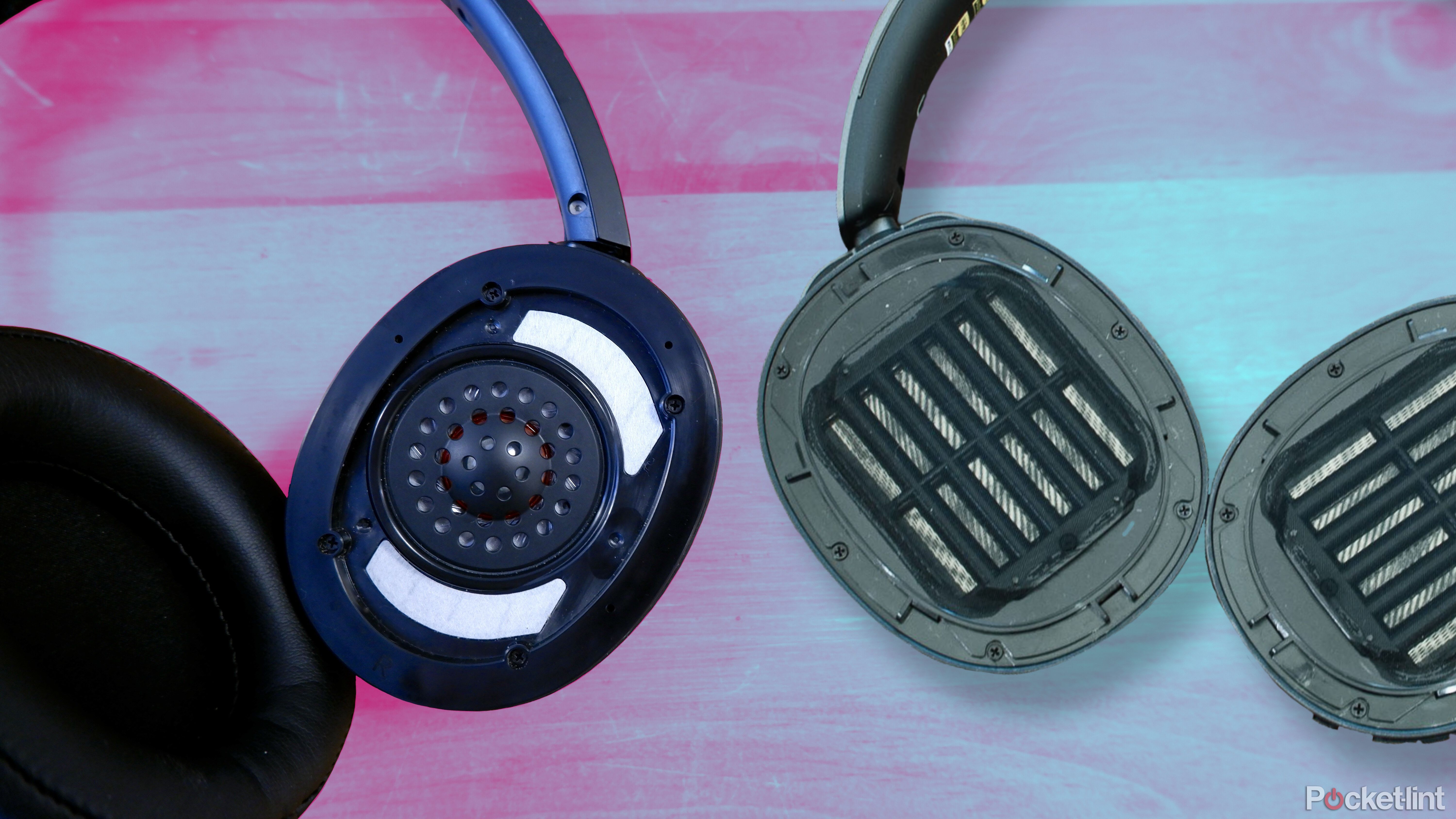 Audio-Technica SR50 headphones with the ear pad taken off, showing the driver, beside the Edifier Stax Spirit S5 with the ear cups removed.