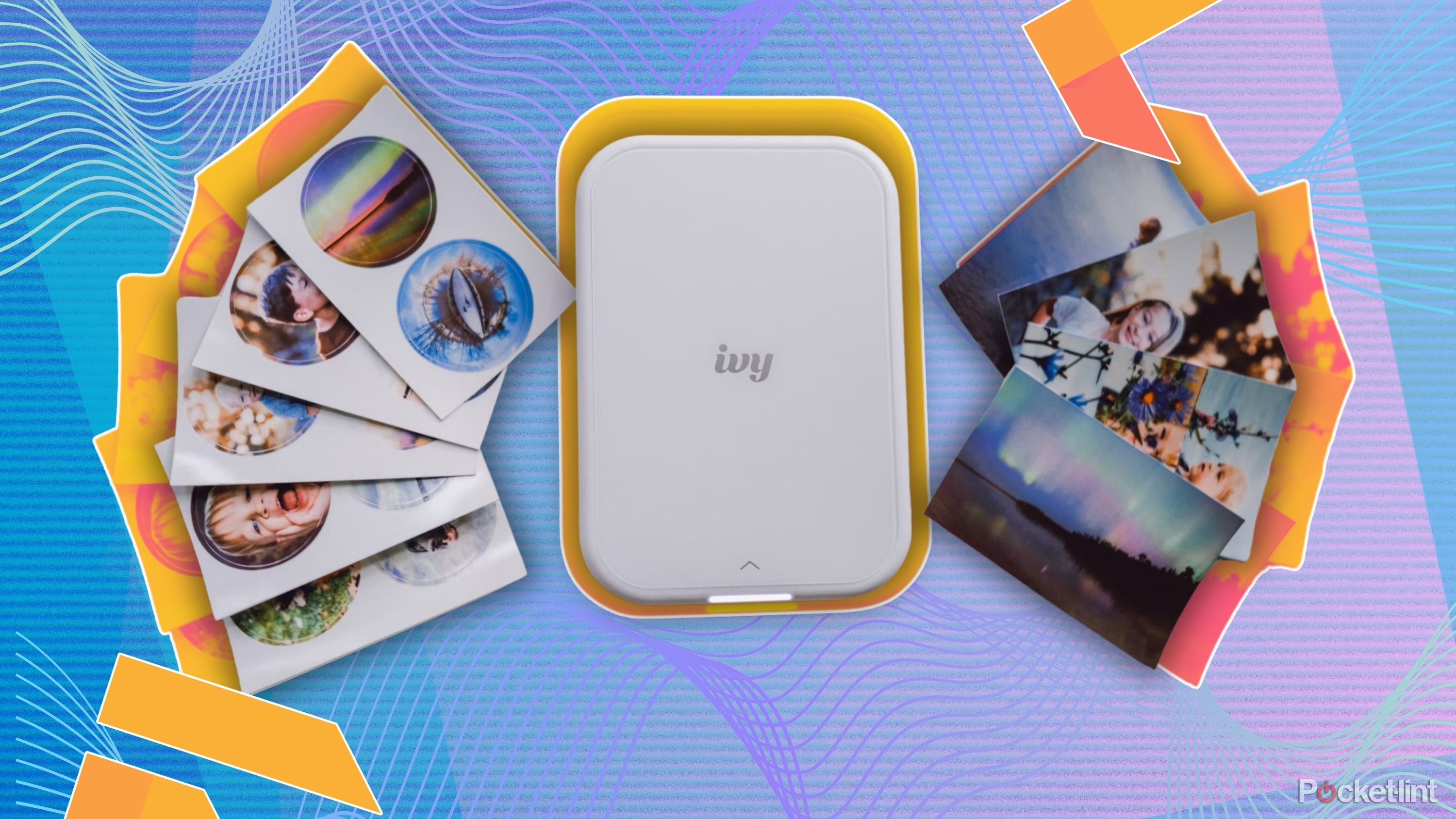 Canon Ivy 2 printer with photos beside it