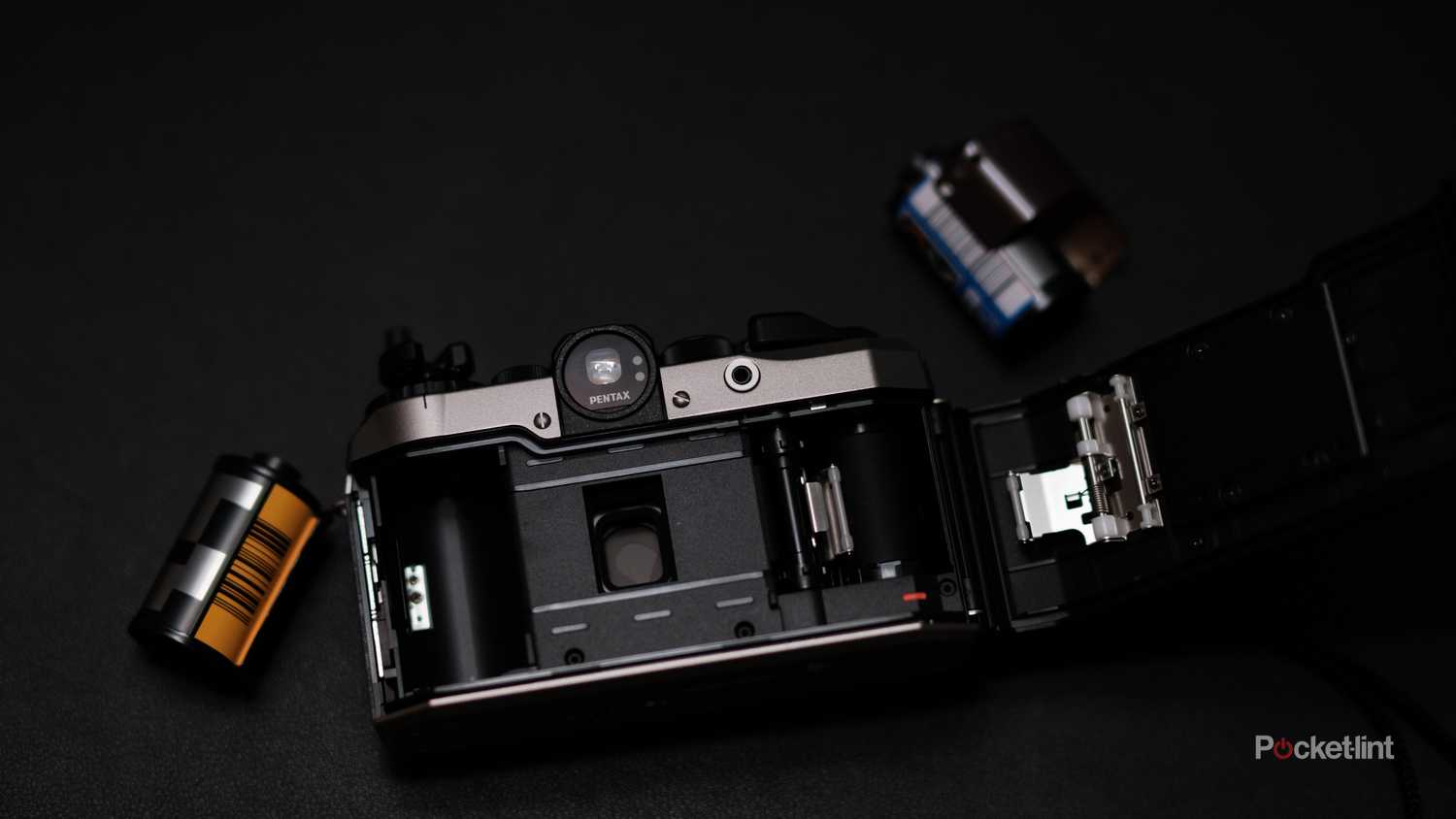 A photograph of the Pentax 17 film camera with the back open