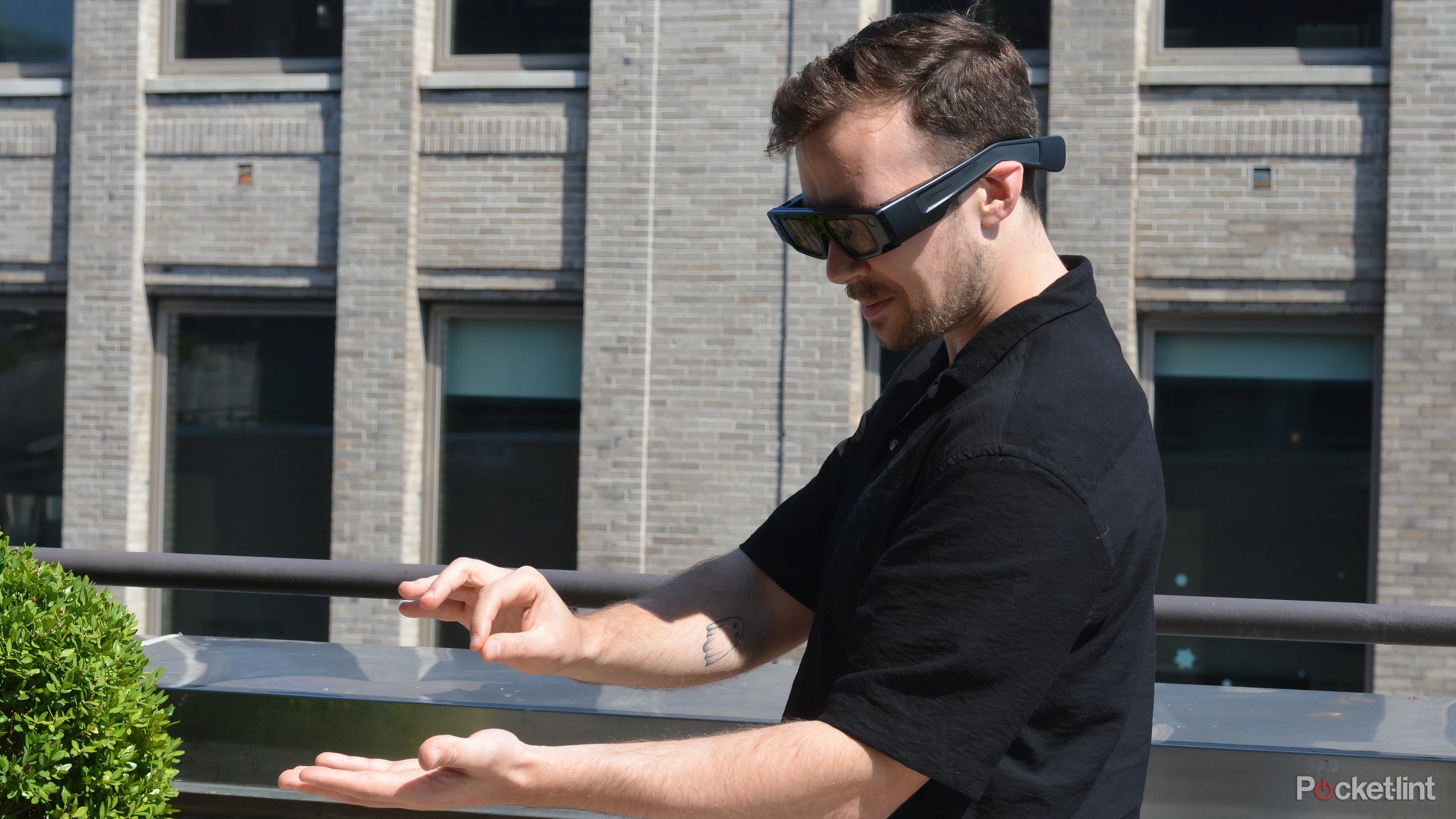 Developer demonstrating hand gesture interaction with Snap Spectacles