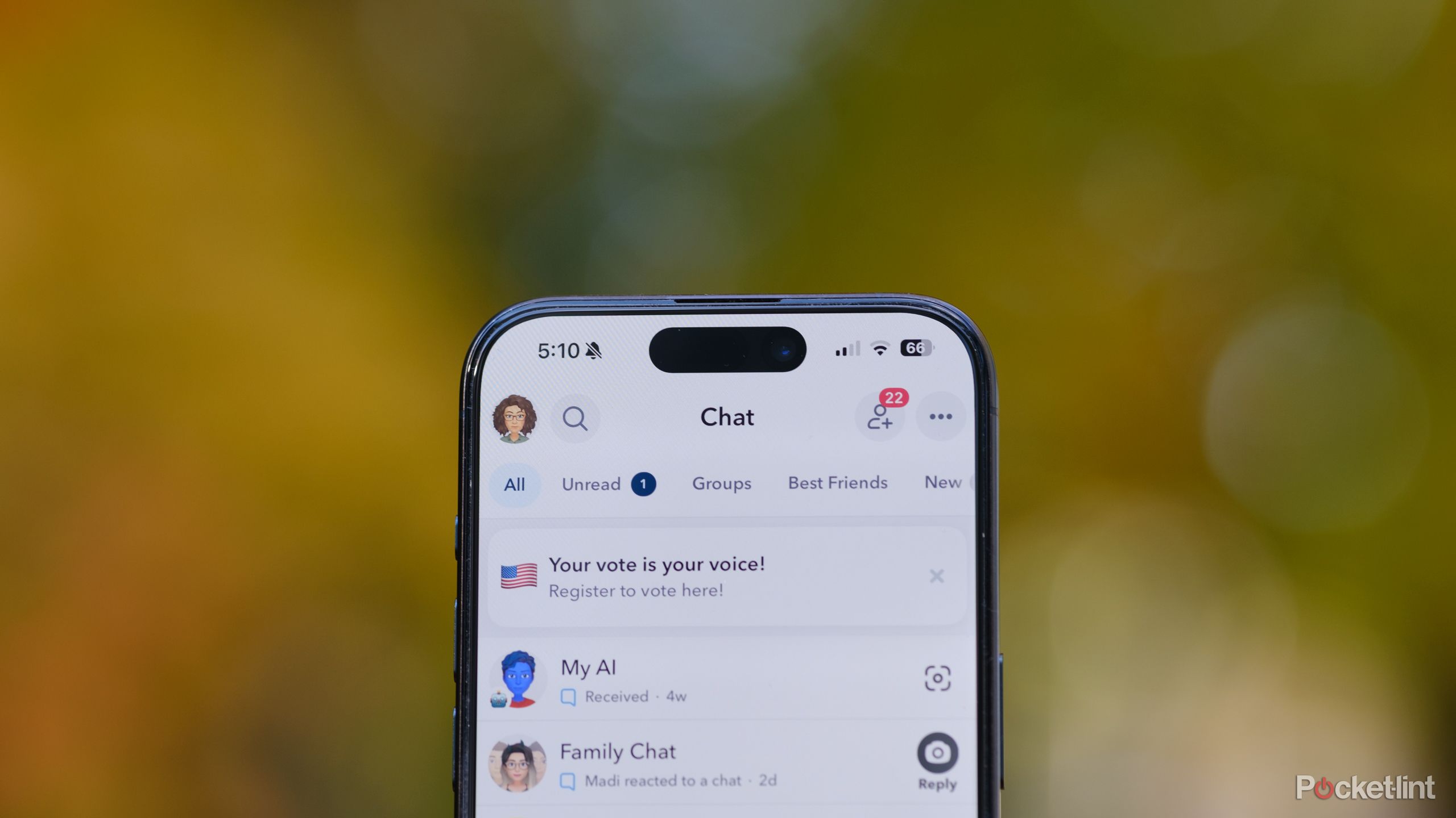 A hand holds an iPhone with a Snapchat video call