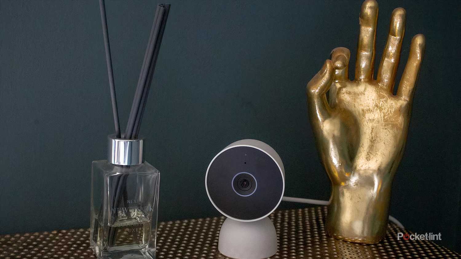 The Google Nest Cam wired on table with props