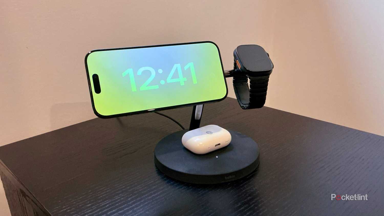 A Belkin 3-in-1 wireless charging stand with an iPhone, AirPods, and Apple Watch Ultra 2.