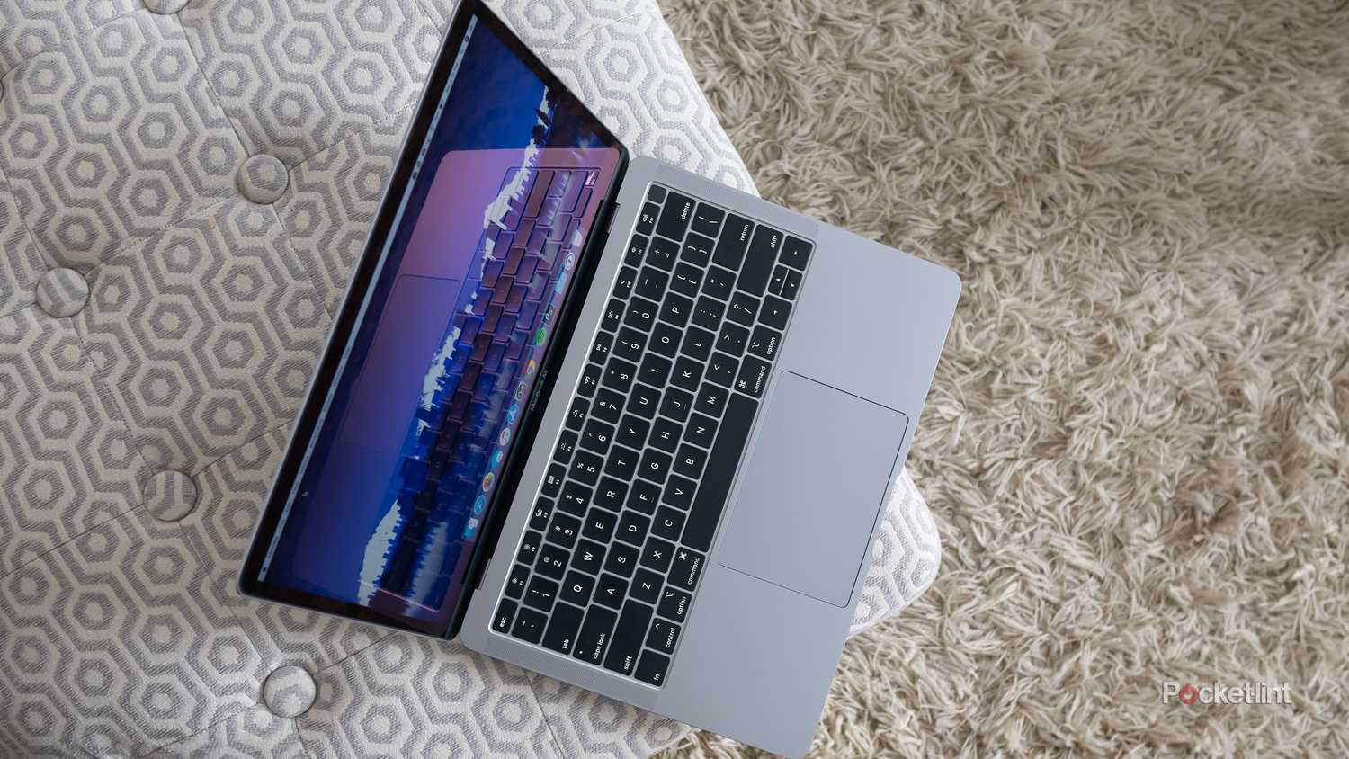 MacBook Air Butterfly keyboard sitting on a pillow. 