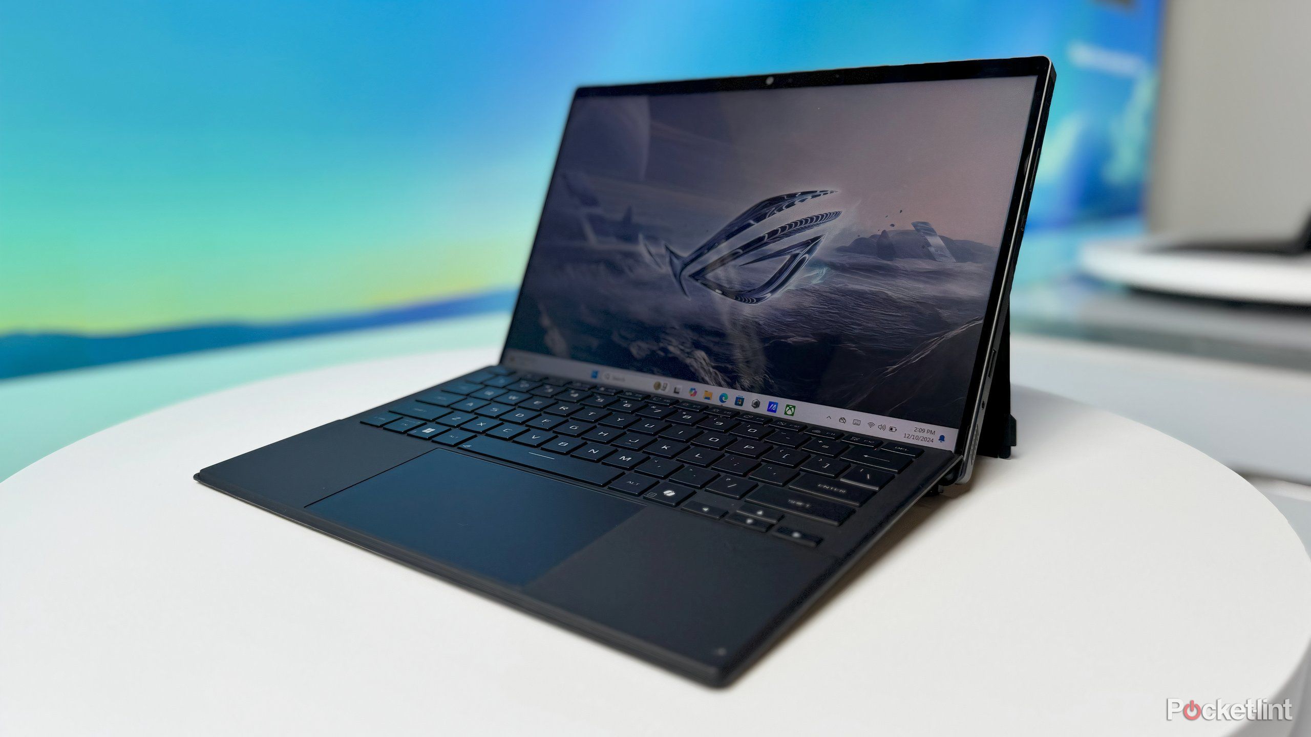 ROG Flow Z13 with a spaceship against a futuristic landscape. 