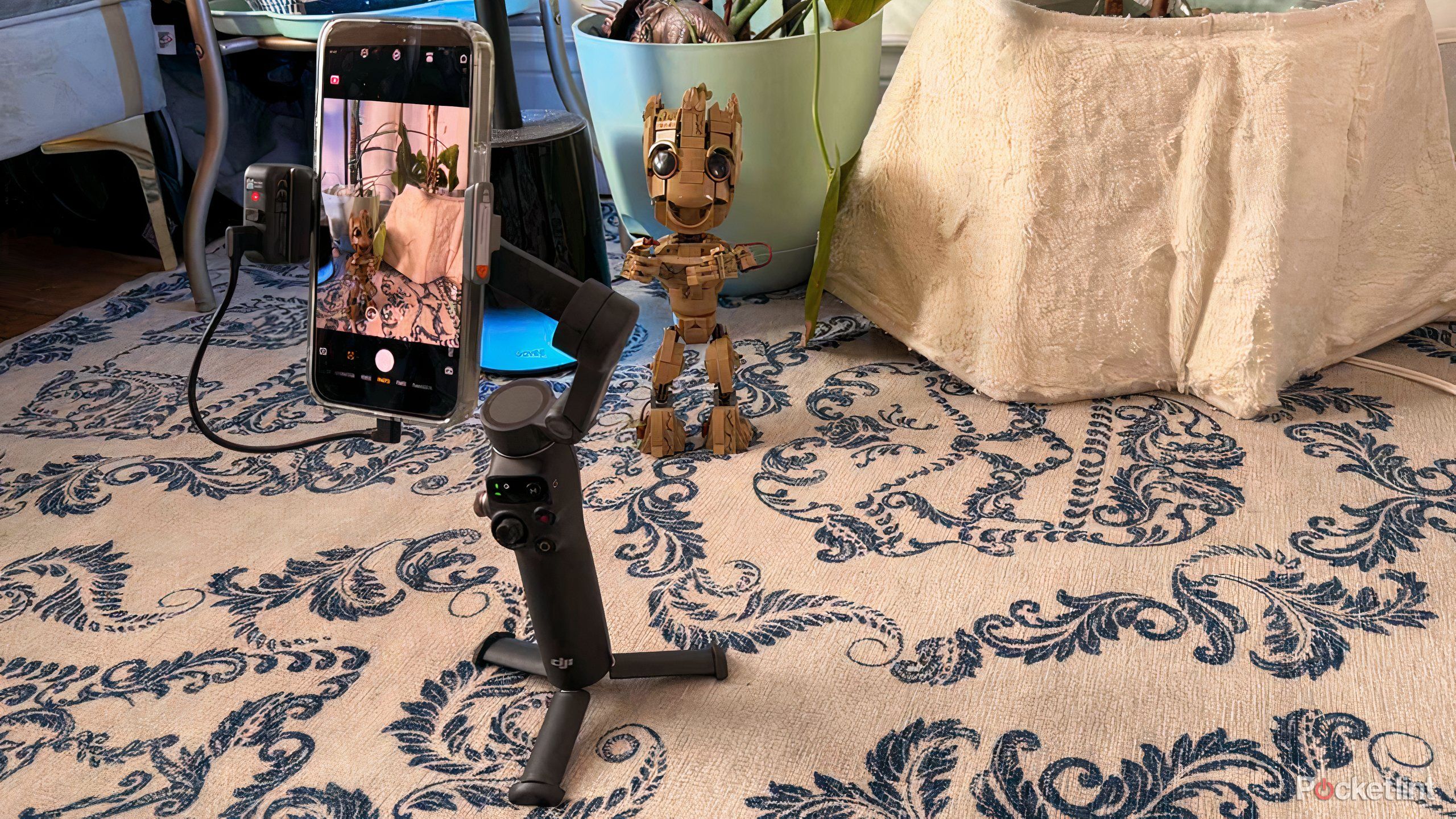 The DJI Osmo 7pm Gimbal taking a picture of Baby Groot. 
