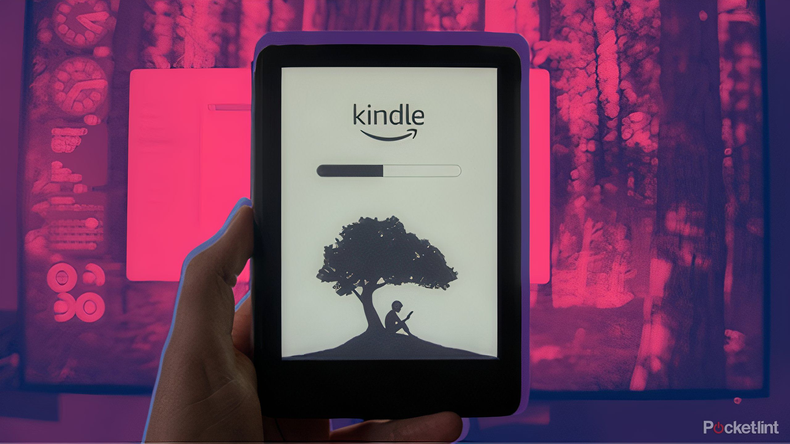 A hand holding a Kindle with a loading bar over a dark red background.