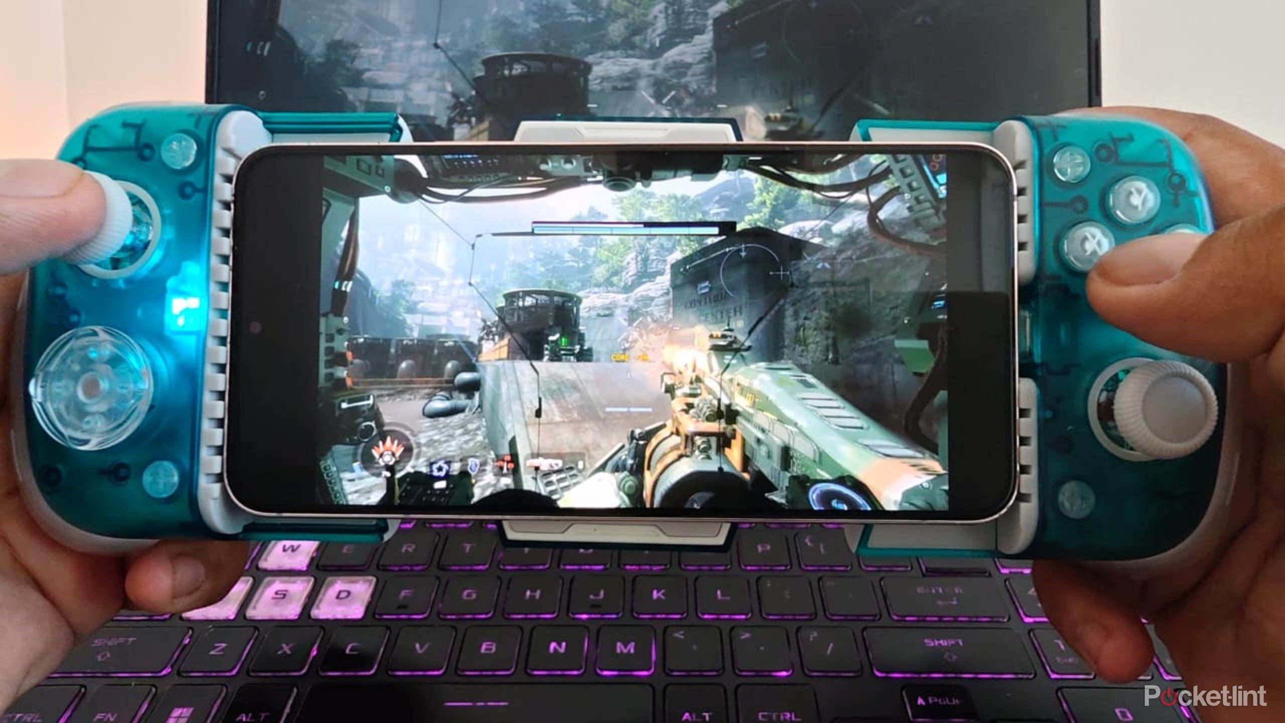 GameSir X3 Pro in a hand playing a first person shooter game. 
