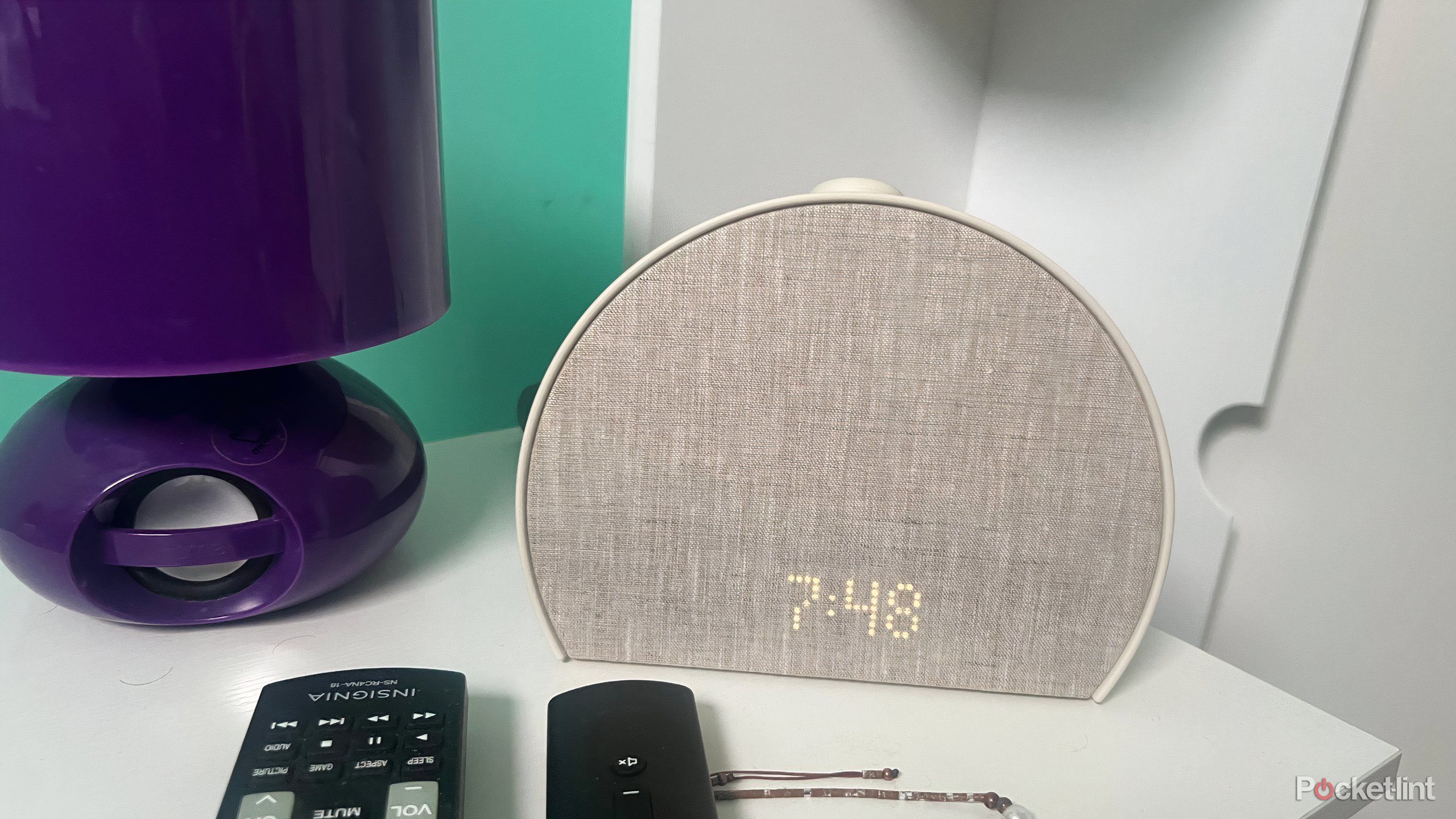 The Hatch Restore alarm clock on a nightstand. 