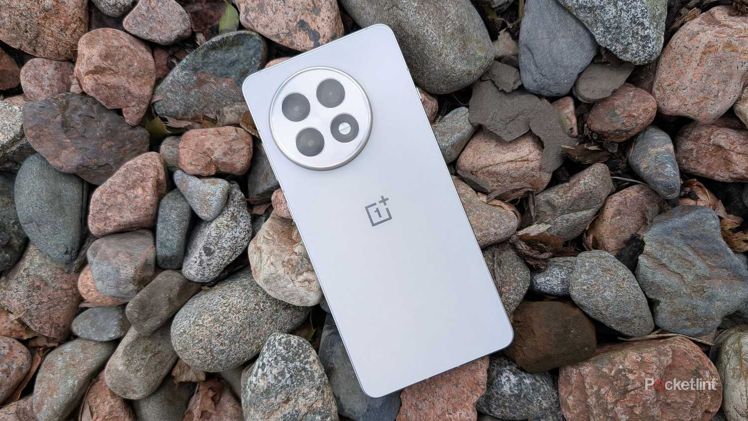 OnePlus 13R beauty shot in rocks. 