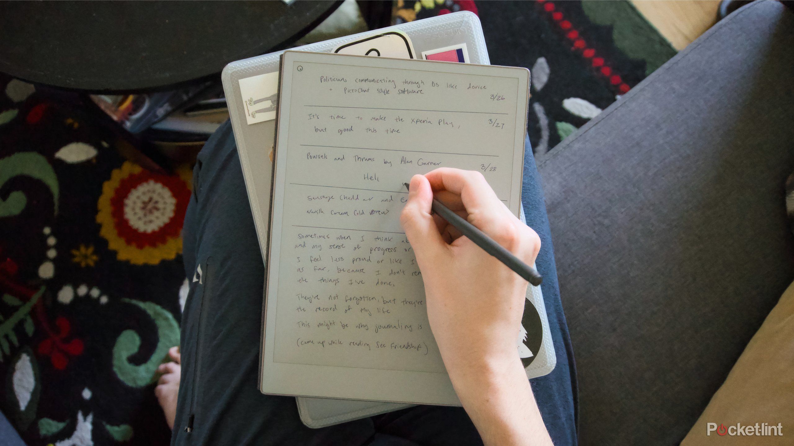 Writing on a reMarkable Paper Pro on top of a closed laptop.