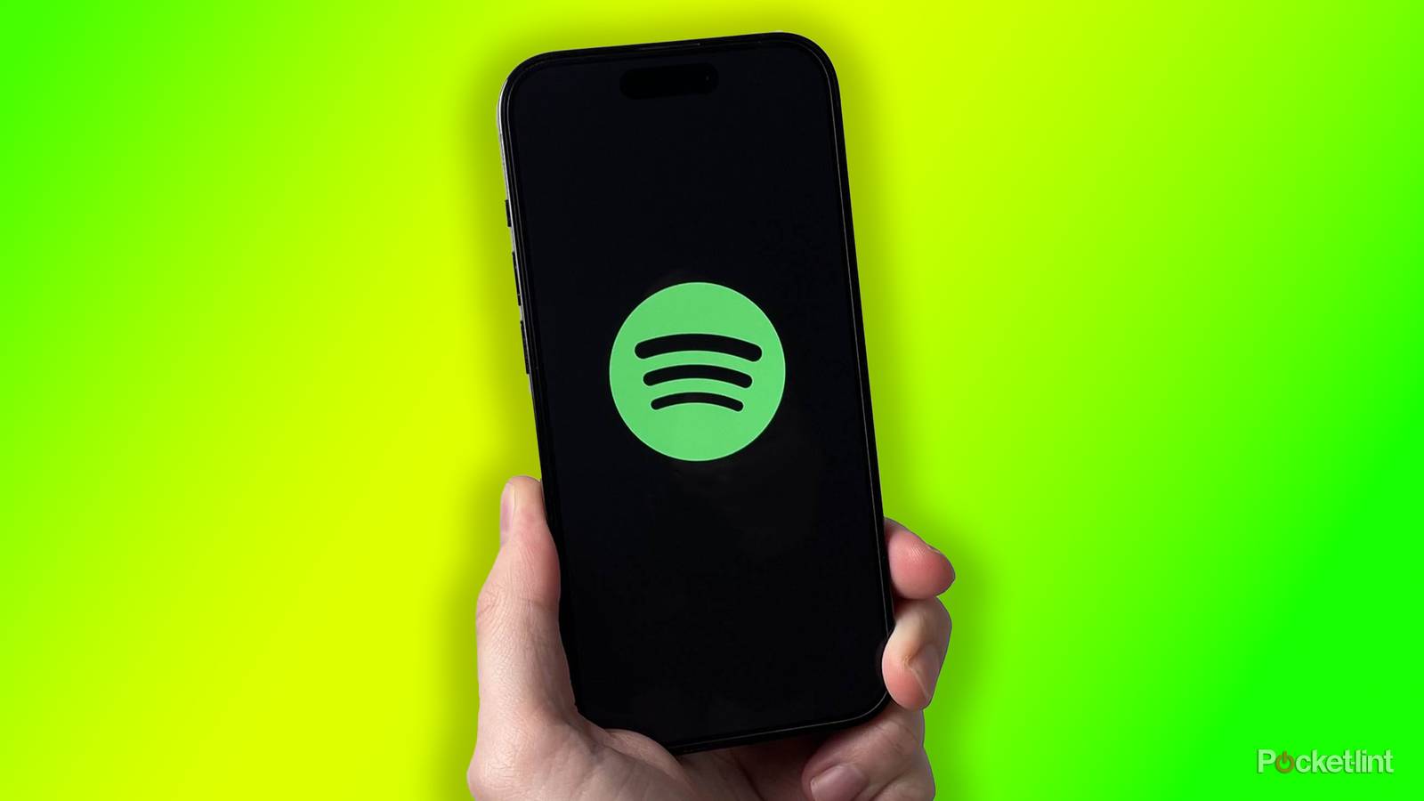 Spotify on iPhone on green background.