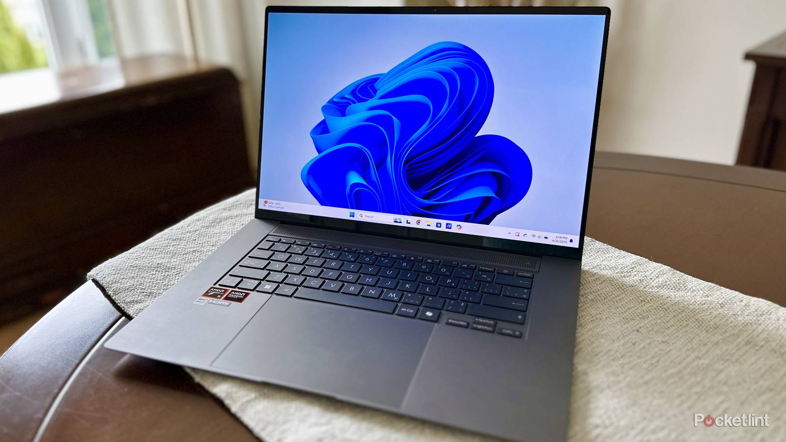 Asus Windows 11 PC on table.