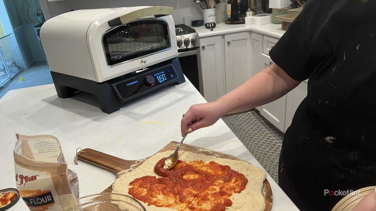 Current Model P Smart Pizza Oven with a pizza being made