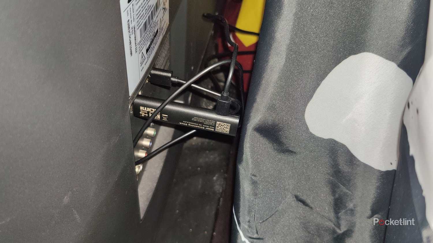 A plugged in Roku Streaming Stick.