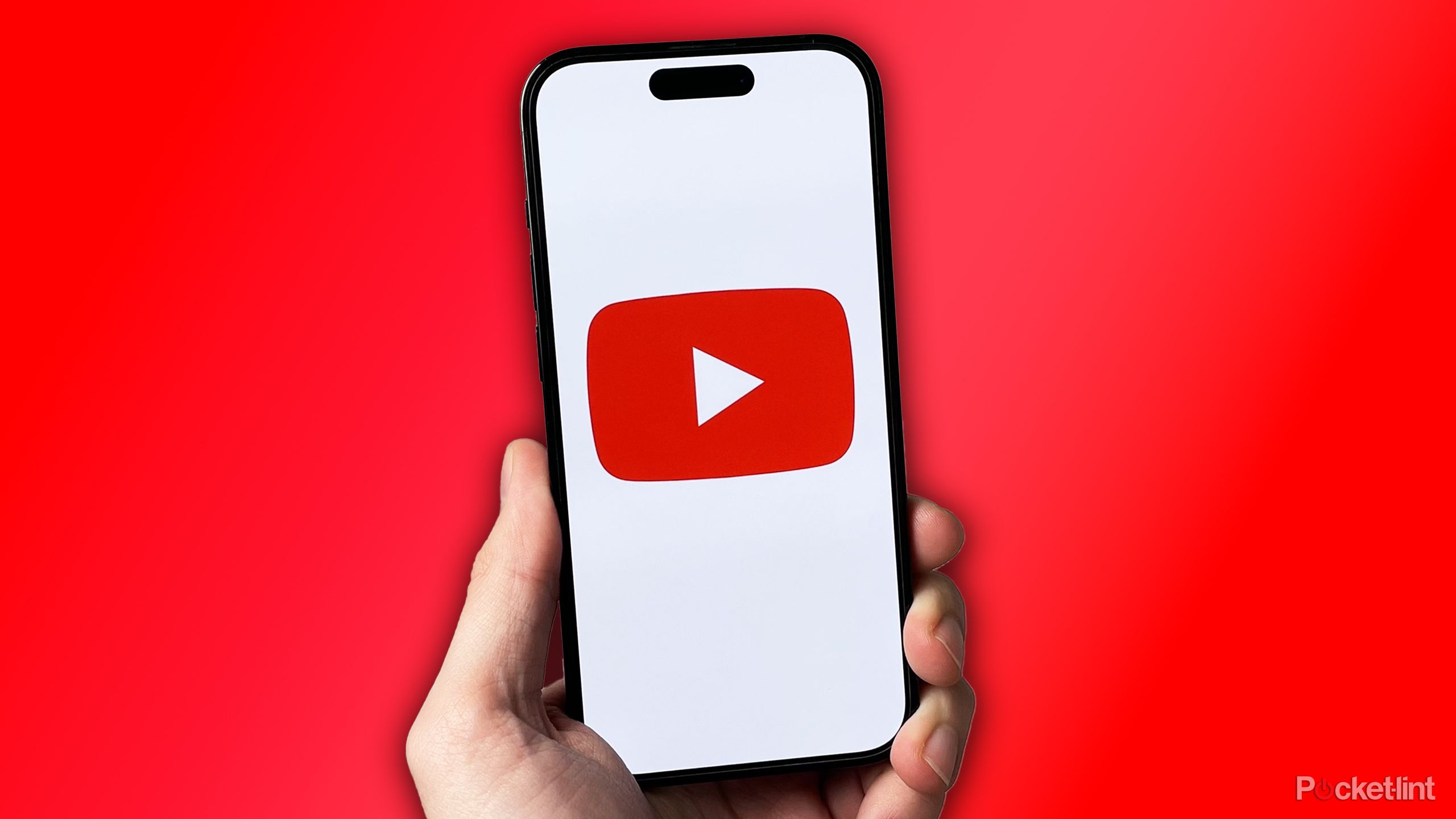 YouTube on iPhone on red background.