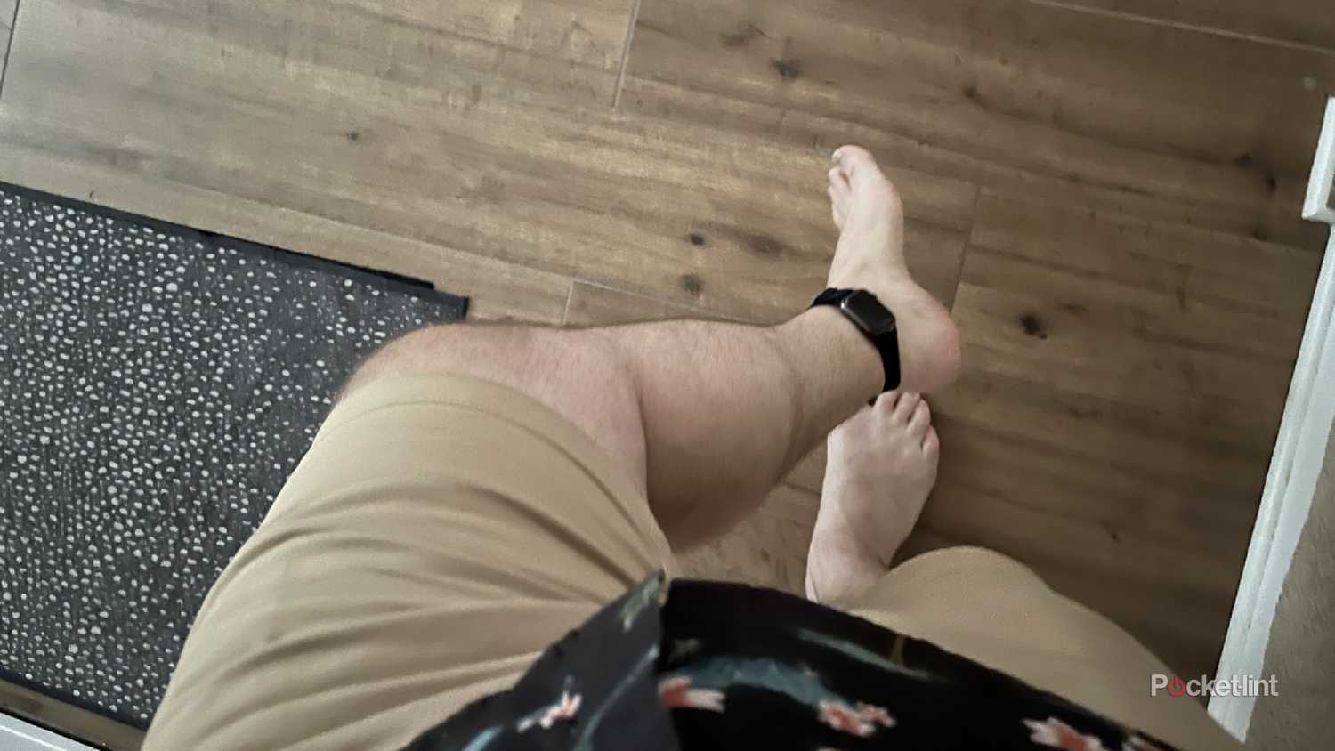 An Apple Watch around an ankle bare feet