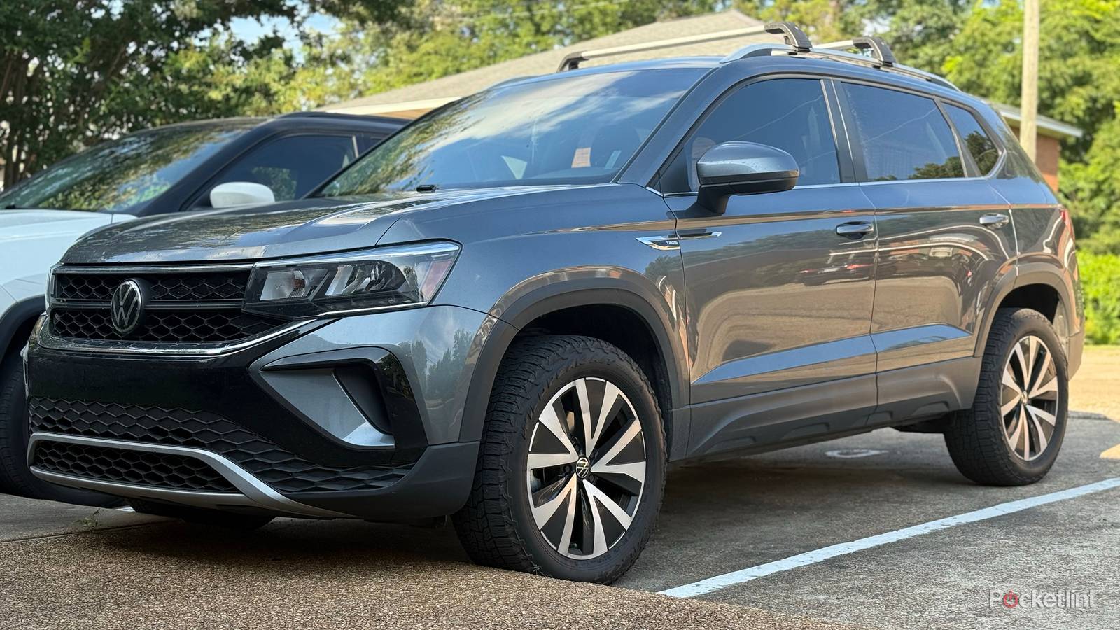A 2022 Volkswagen Taos parked along a curb. 