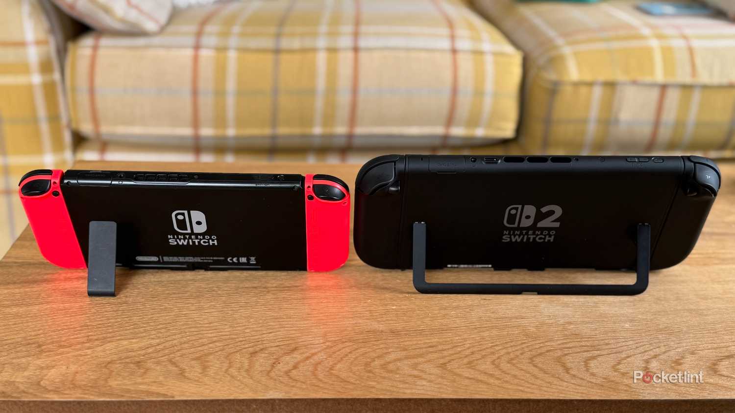 Nintendo Switch 2 and Nintendo Switch seen from the rear on their kickstands.