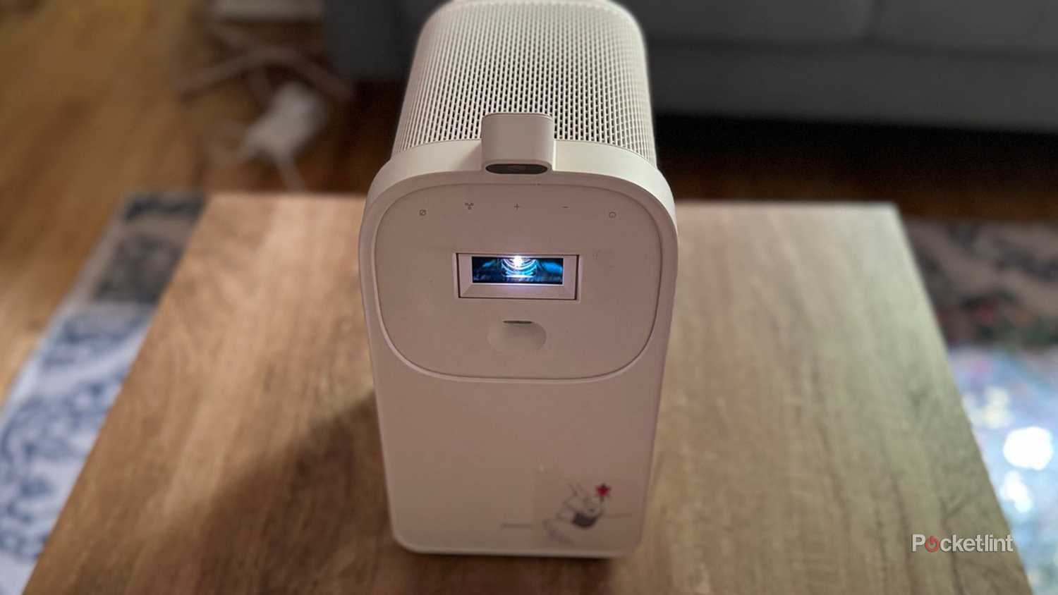 Samsung Premiere 5 Projector on stand with light on. 