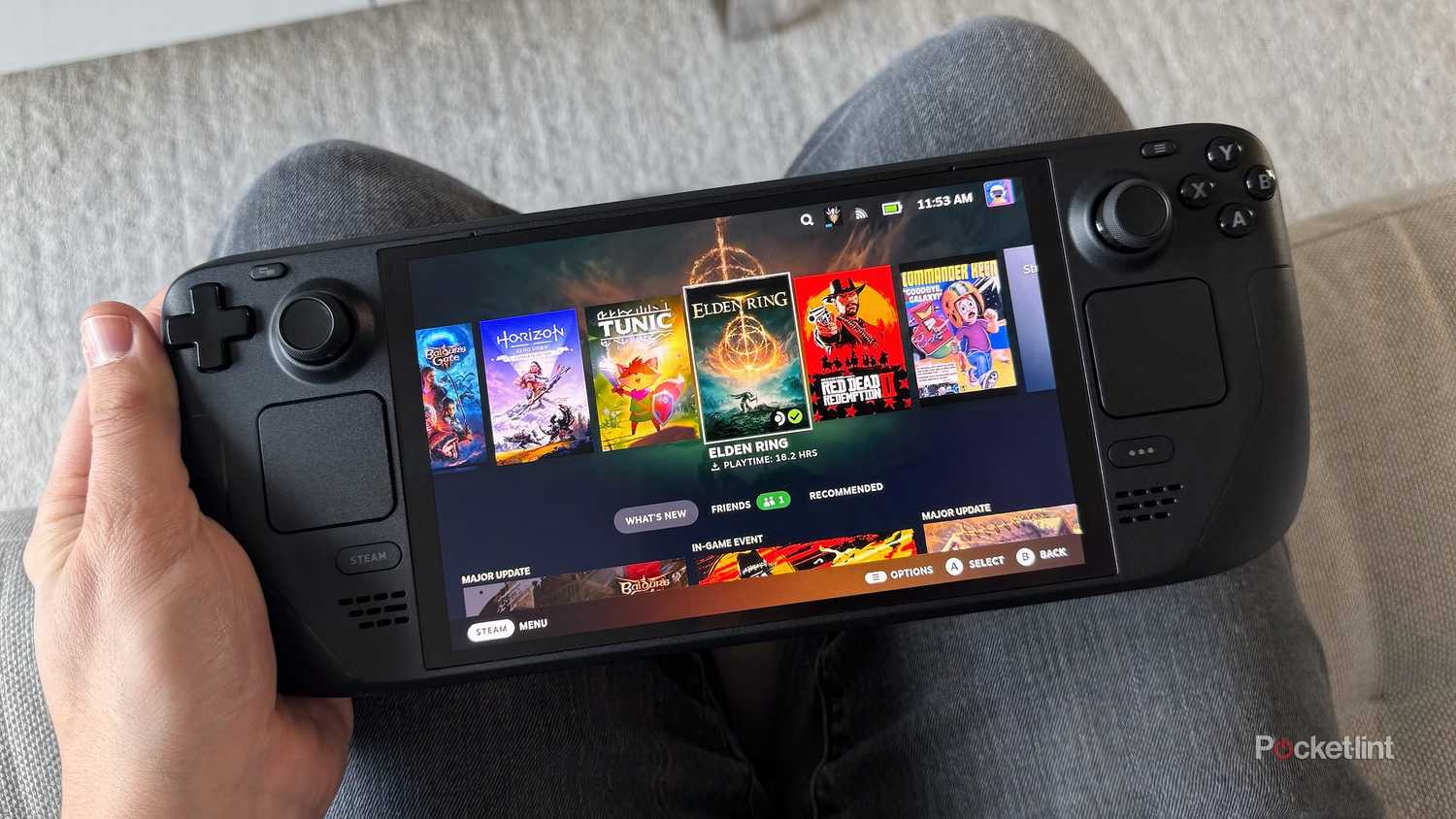 Holding a Steam Deck OLED on a lap