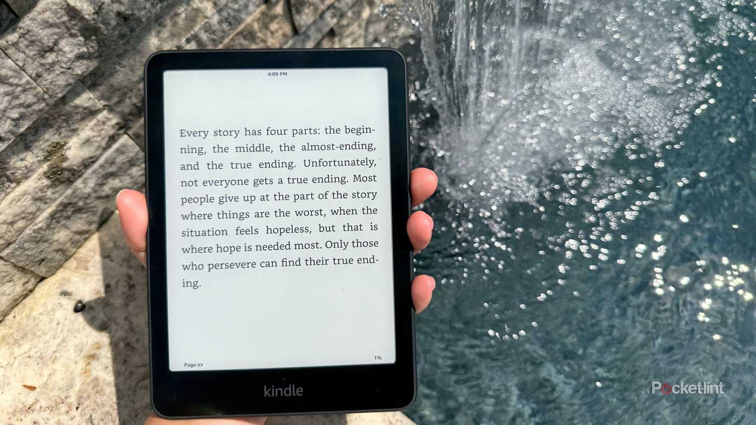 A Kindle Paperwhite by a pool. 