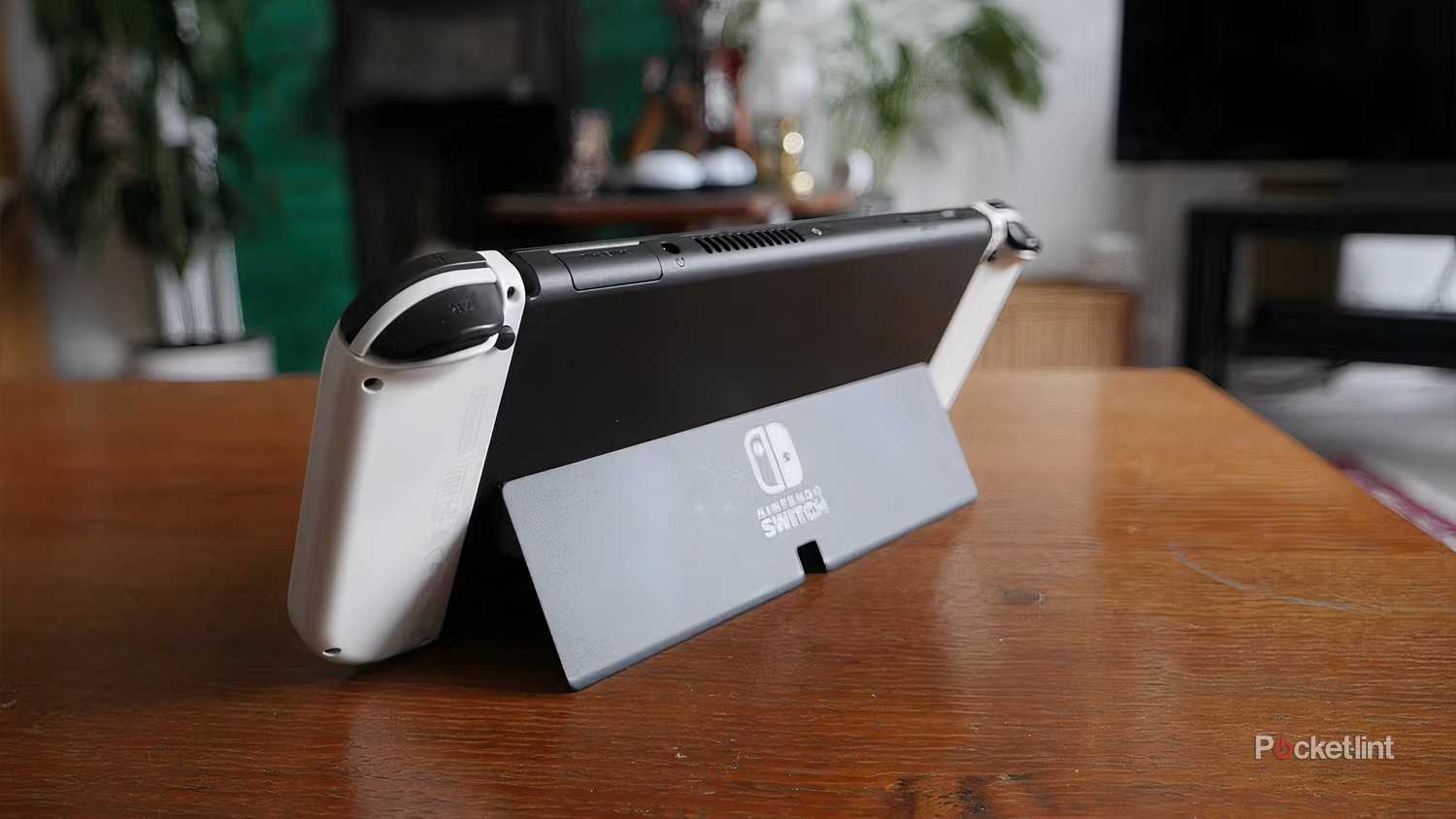 The back of a Switch OLED with its kickstand out.