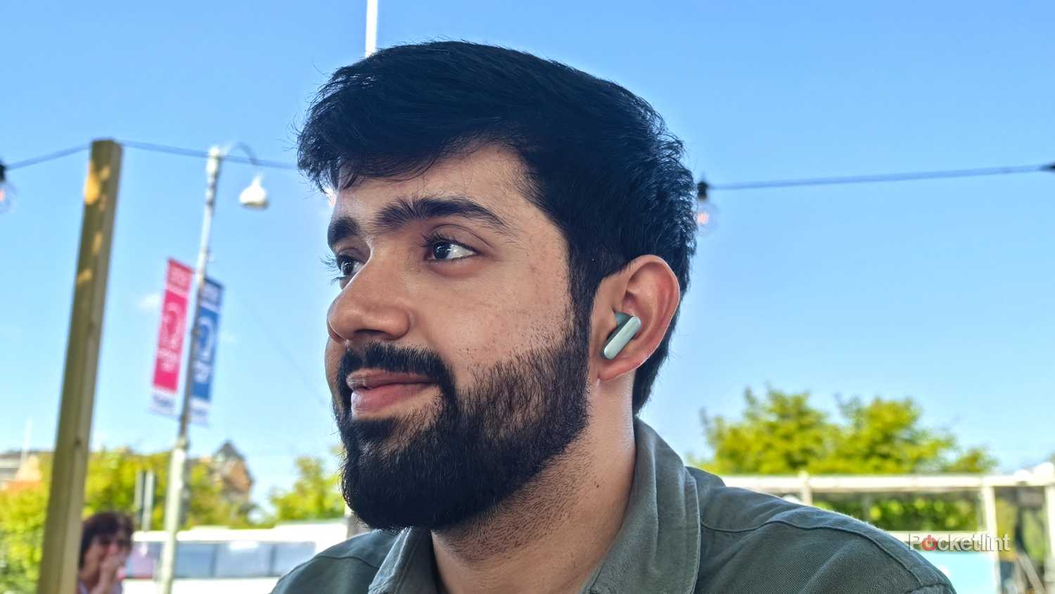 Author wearing the OnePlus Buds 4