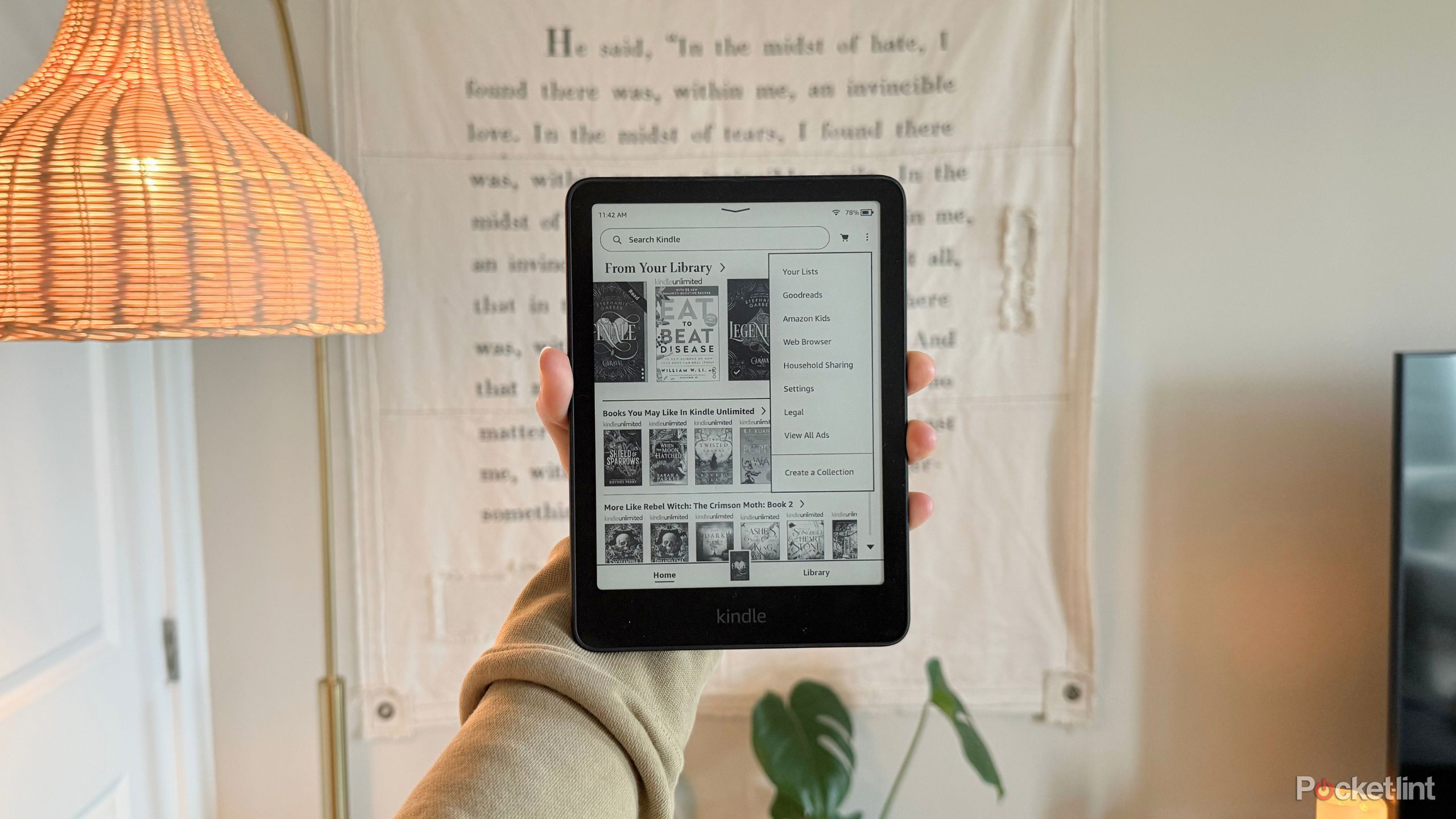 Kelsey holding a Kindle Paperwhite.