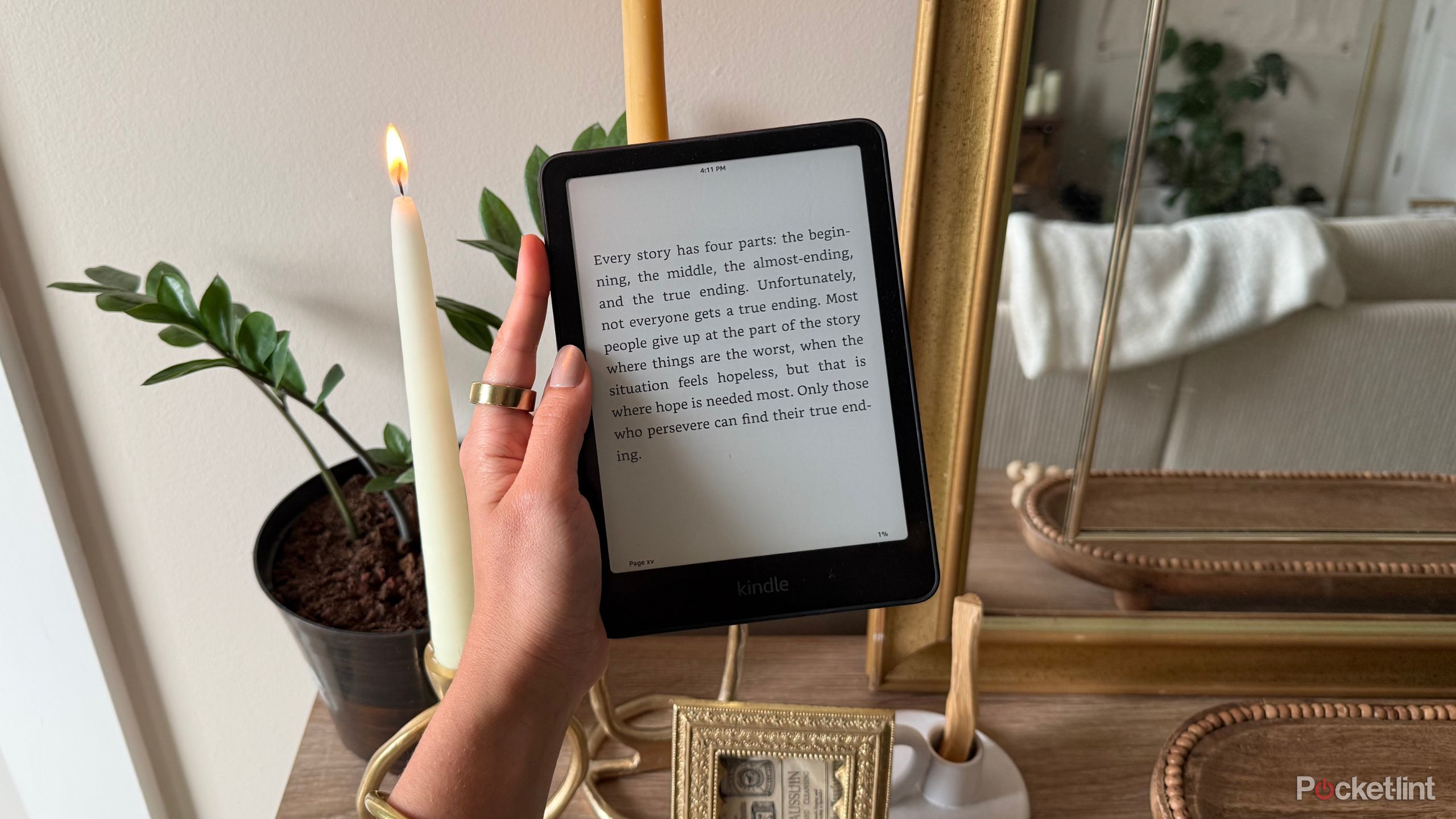 Kindle Paperwhite next to a candle.