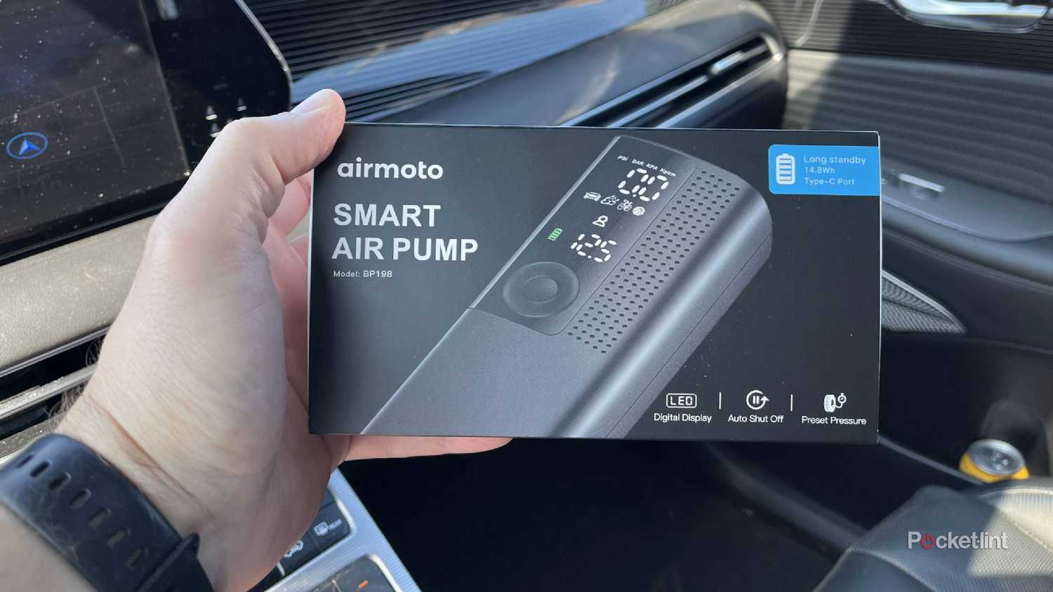 The Airmoto Smart Air Pump box being held.