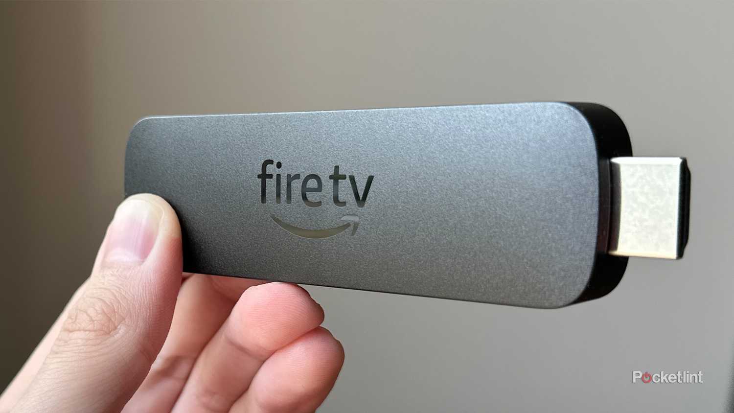 Amazon Fire TV Stick 4K Max in hand.