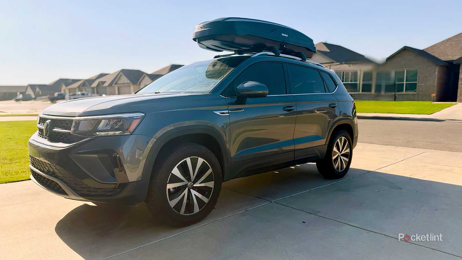 A still photo of my 2022 Volkswagen Taos with the Yakima SkyBox NX Skinny mounted to the roof rack