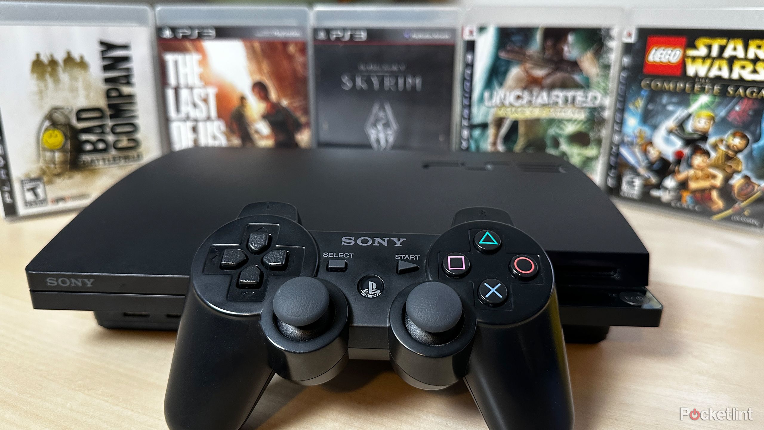 PS3 surrounded by games.