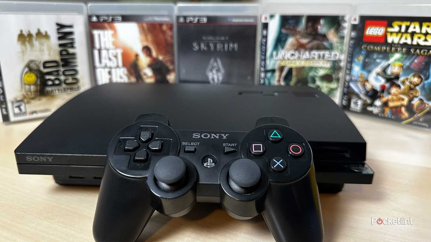 PS3 surrounded by games.