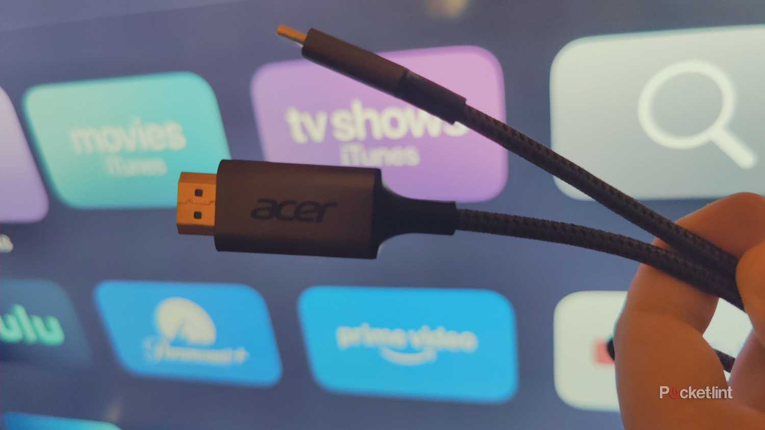person holding usb-c to hdmi cable